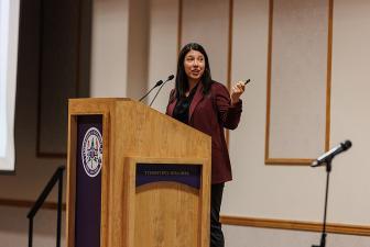 Jillian Peterson speaking at Symposium Against Indifference